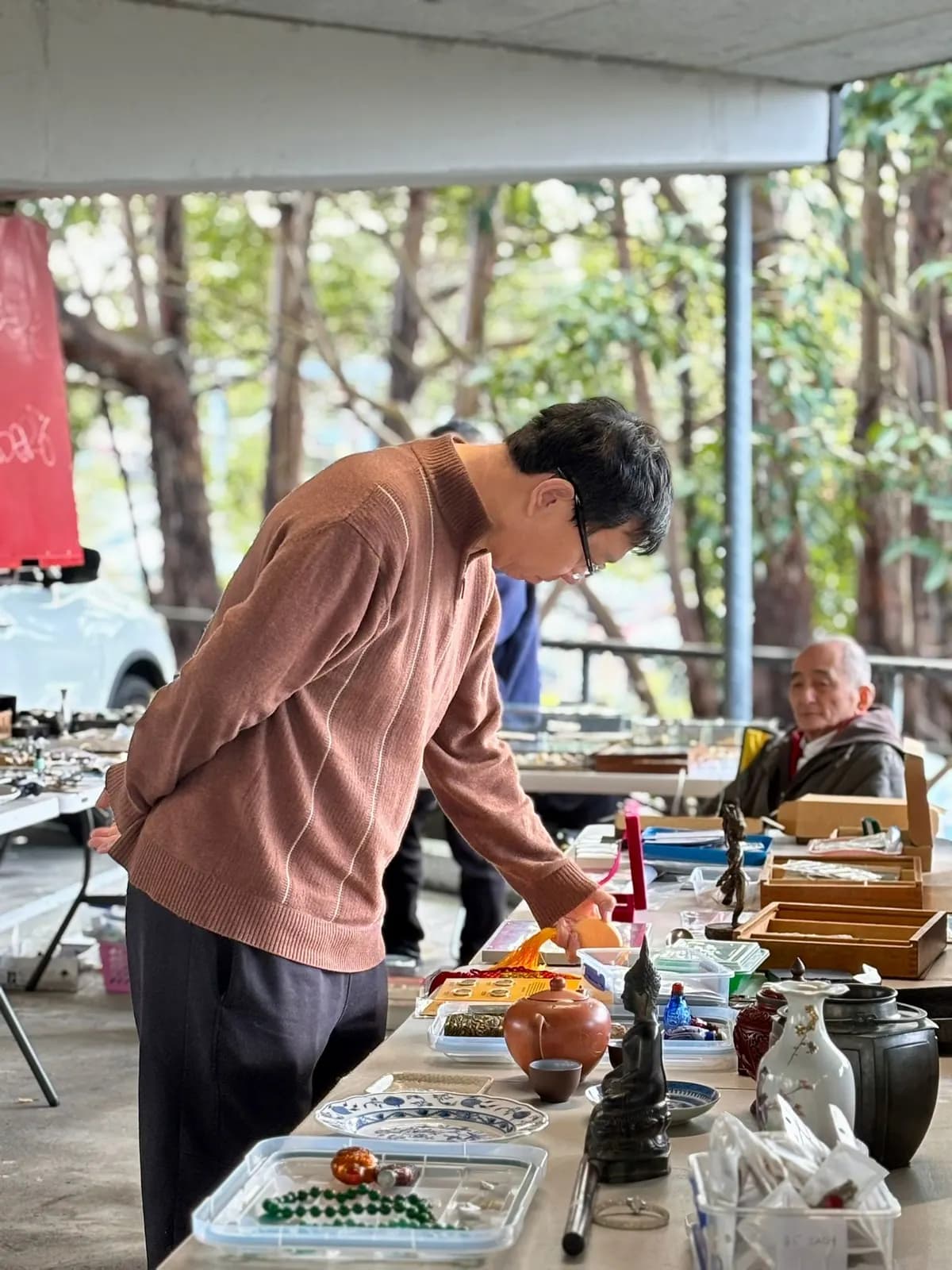 Shopper at a stall at the Gordon Markets