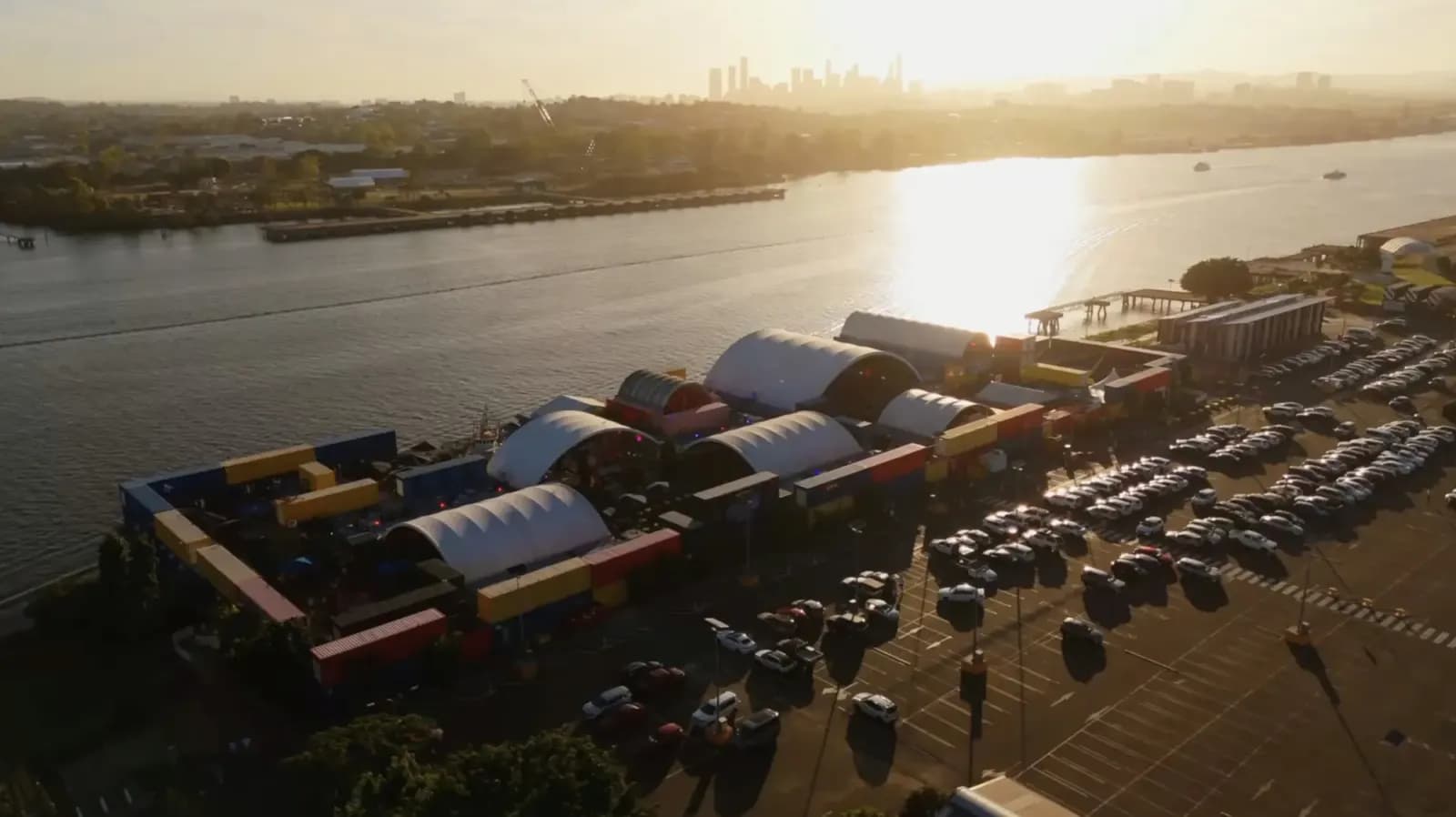 Aerial view of Eat Street Northshore beside the Brisbane River at sunset