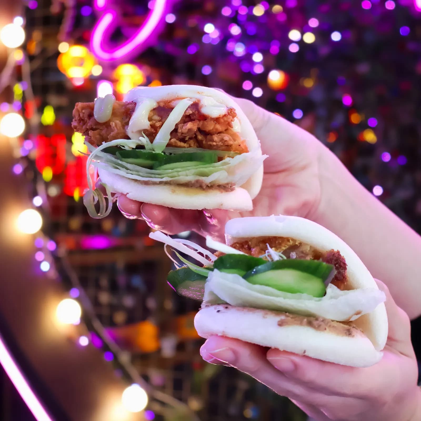Bao buns under neon lights at Burwood Chinatown Night Markets