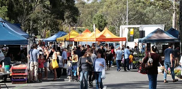 Crowds among the stalls at Kingsbury Drive Community Market