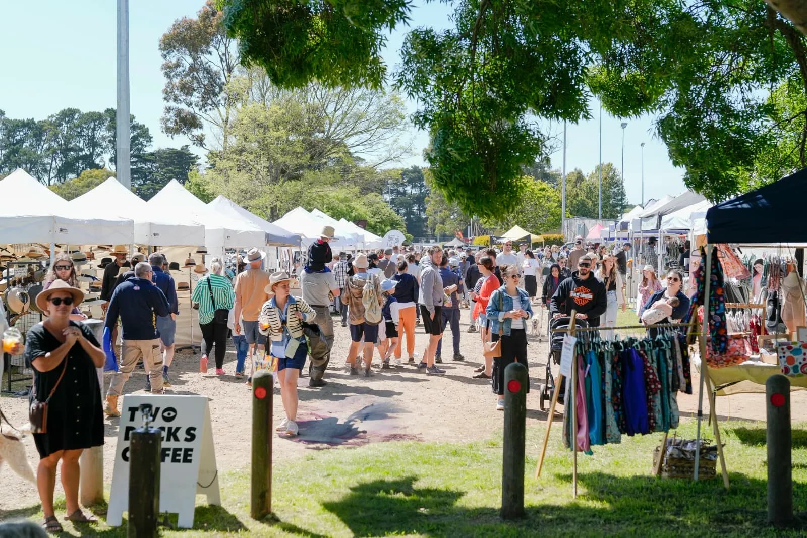 Crowds and stalls at the Red Hill Recreation Reserve market