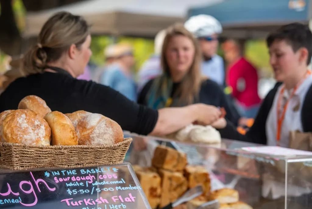 Customers at a bread stall at Willunga Farmers Market