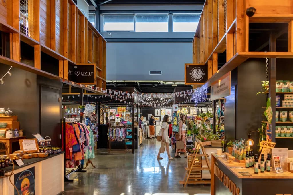 Inside Origins Market Busselton, with stalls along a timber-lined hall