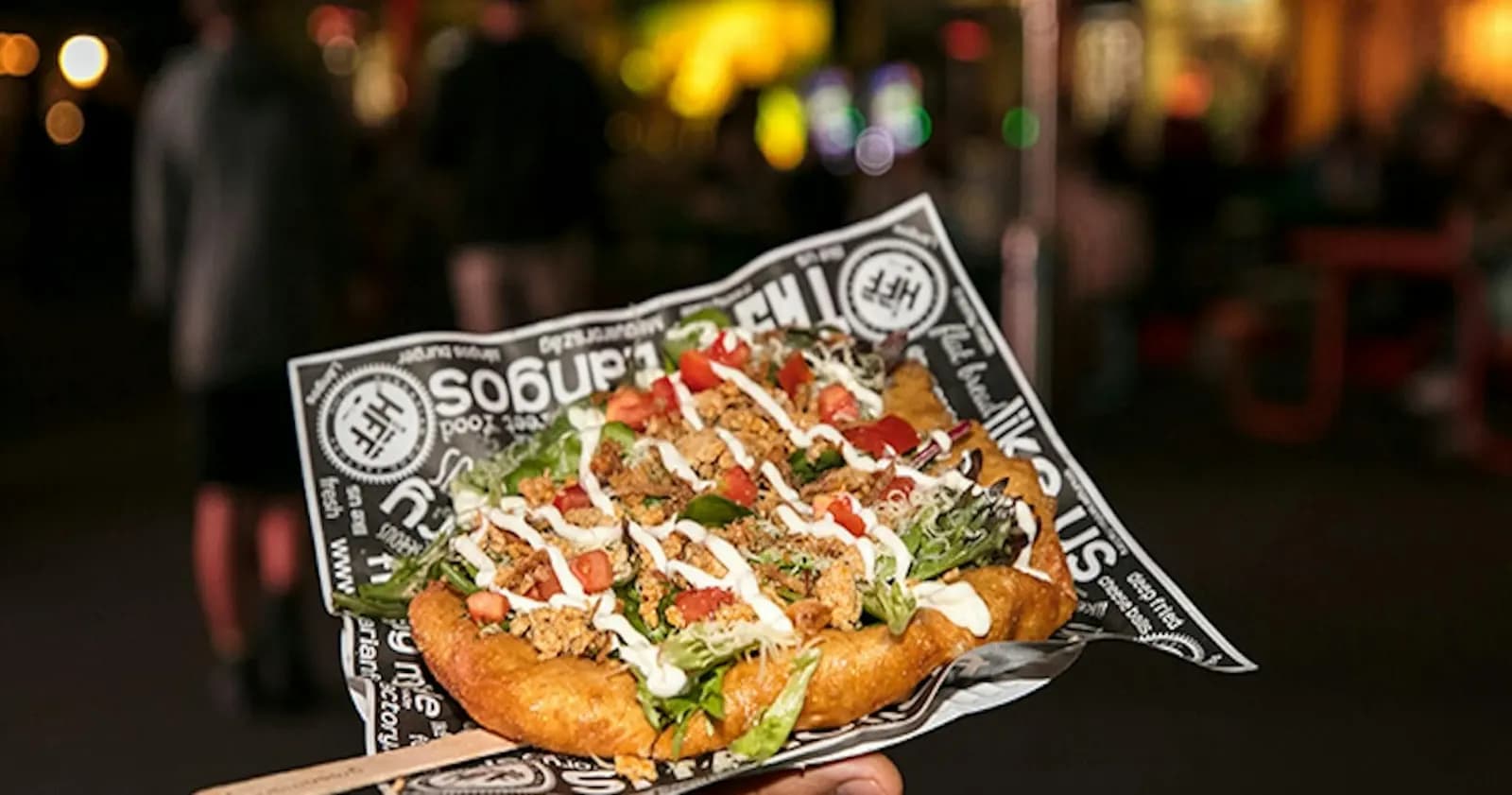 Loaded street food on paper at Dreamworld Night Market