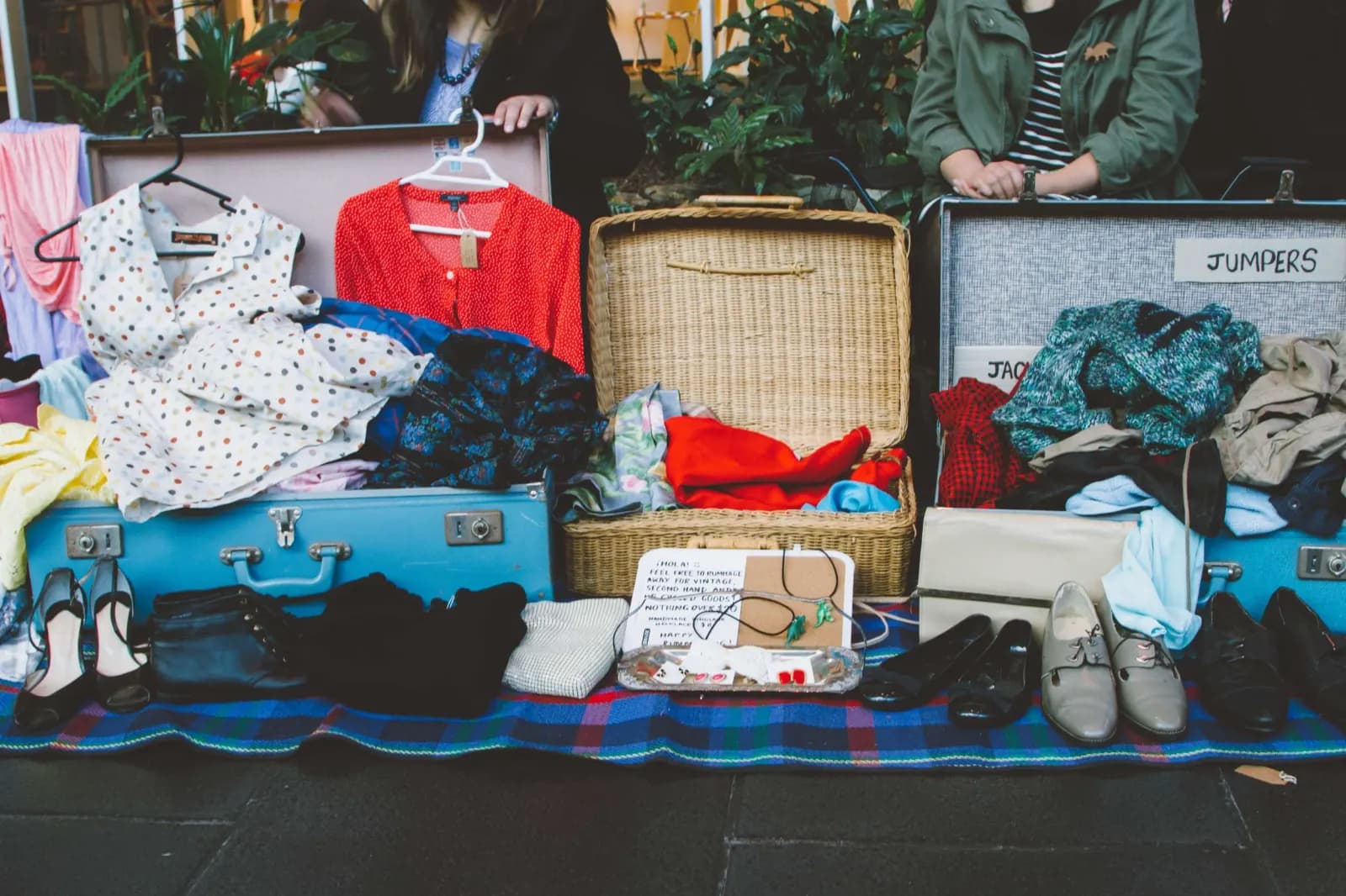 Open suitcases of secondhand clothes at Suitcase Rummage