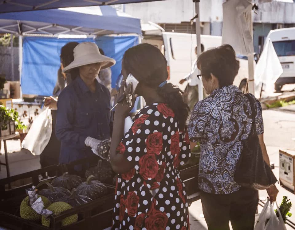 Shoppers at a produce stall at Global Food Markets in Woodridge
