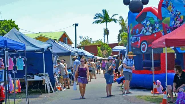 Stalls and shoppers at the Caboolture Country Markets