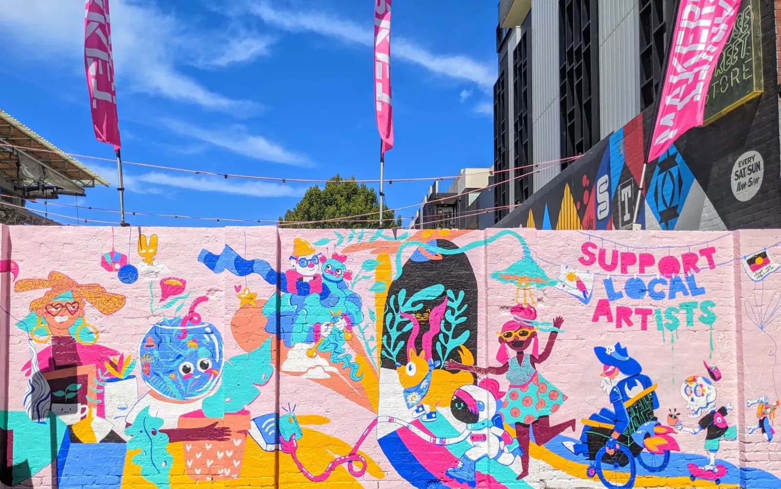 The painted mural wall outside The Rose Street Artists Market in Fitzroy