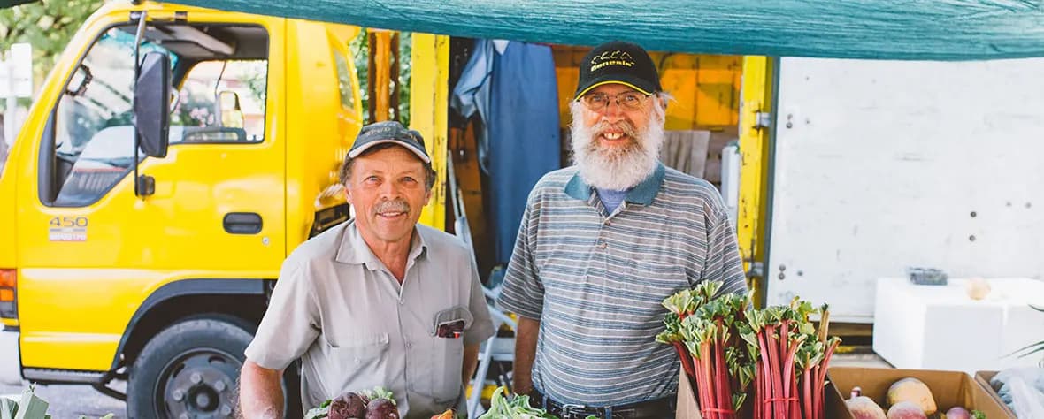Two growers beside their truck at Adelaide Showground Farmers Market