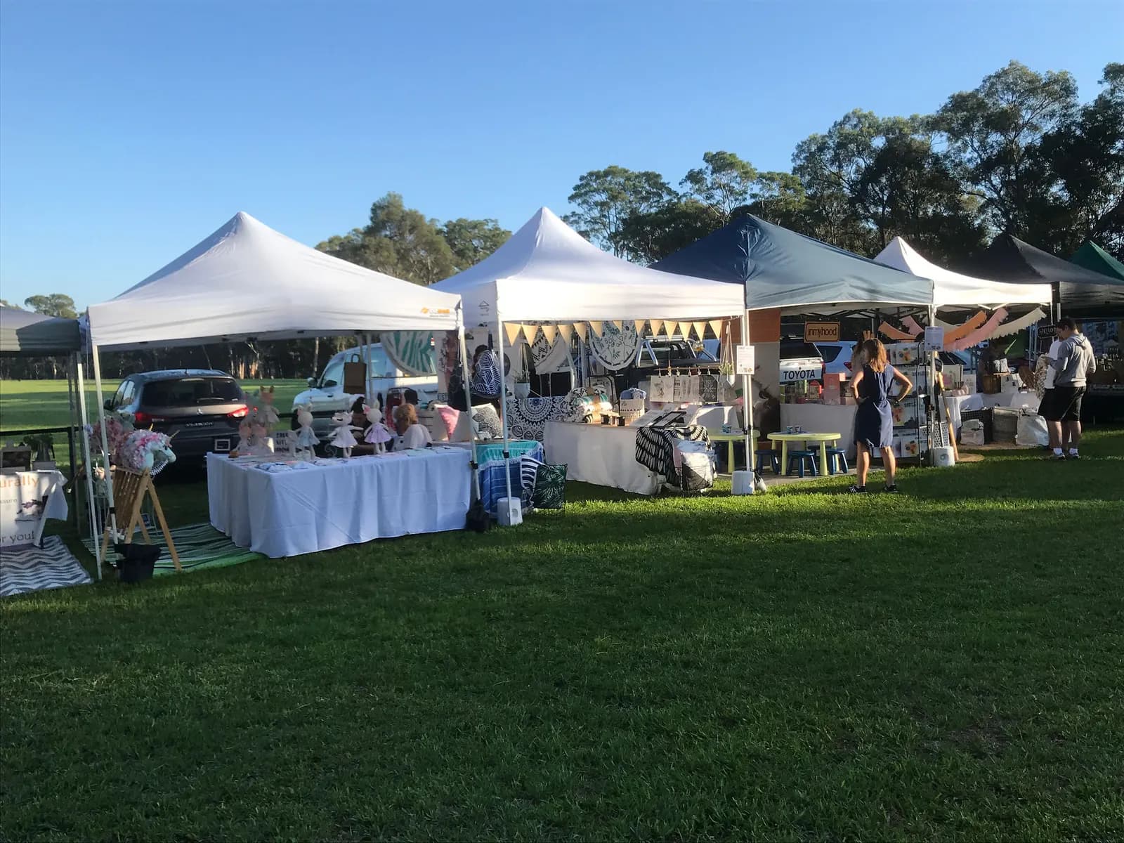 White marquees on the grass at The Hills UPmarket